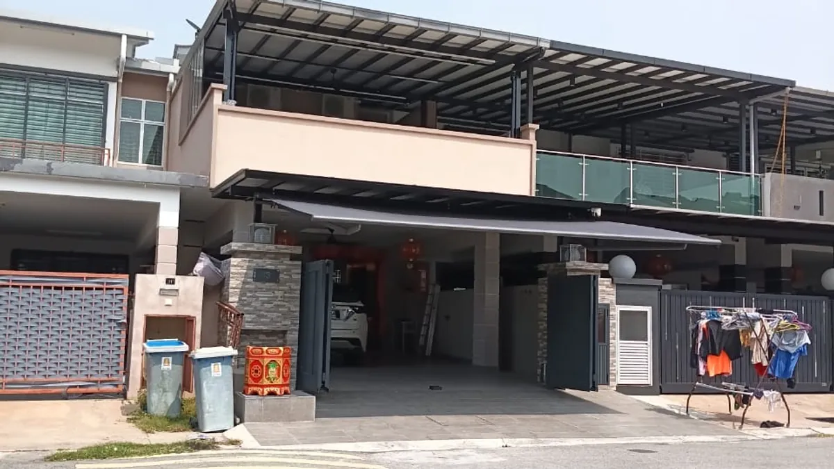 A dark grey retractable awning over the car porch of a terrace house