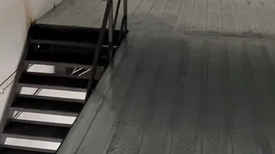 A mezzanine floor laid in GI steel deck, with a steel staircase up to it